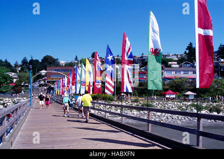 White Rock, BC, British Columbia, Canada, Colourful Banners of Provincial Flags displayed on White Rock Pier along Semiahmoo Bay Stock Photo