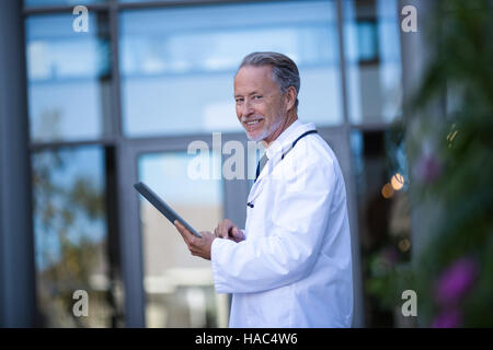 Doctor using digital tablet Stock Photo