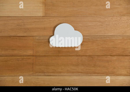 Cloud paper on wooden plank Stock Photo