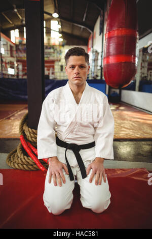 Karate player sitting in seiza position Stock Photo
