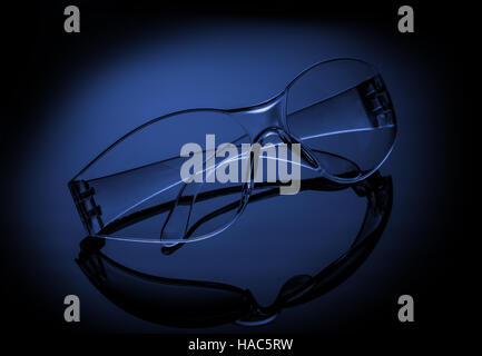 Safety glasses on blue backgrond Stock Photo