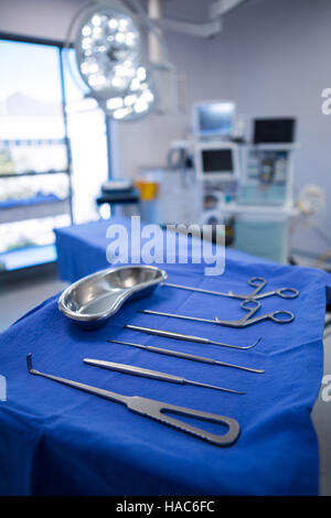 Various surgical tools kept on a table in operation theater Stock Photo