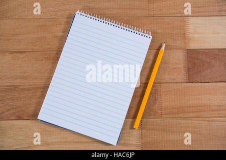 Close-up of notepad and pencil Stock Photo