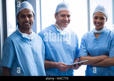 Surgeons discussing over digital tablet Stock Photo