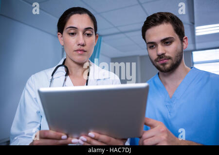 Doctors discussing over digital tablet Stock Photo