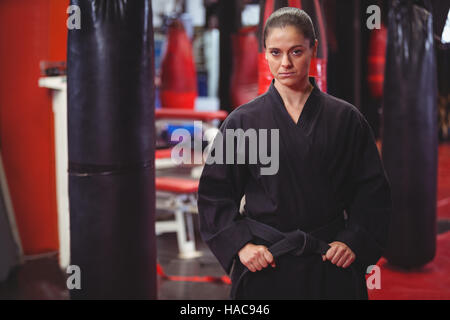 Female karate player performing karate stance Stock Photo
