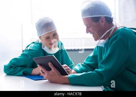 Surgeons having discussion on file Stock Photo
