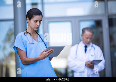 Doctor and nurse using digital tablet Stock Photo
