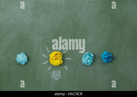 Light bulb created with crumpled paper balls Stock Photo