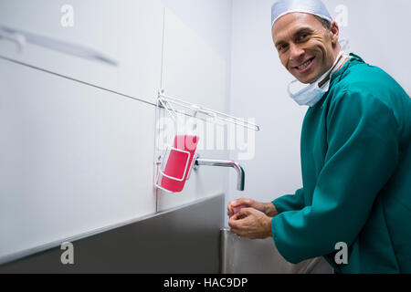 Portrait of surgeon washing hands Stock Photo