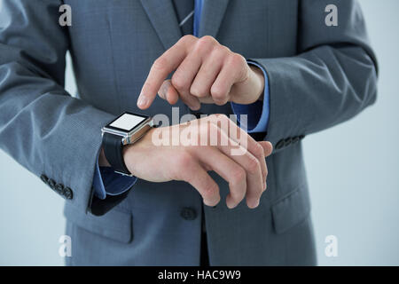 Businessman using his smart watch Stock Photo