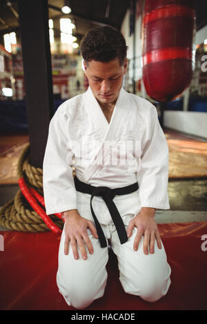 Karate player sitting in seiza position Stock Photo