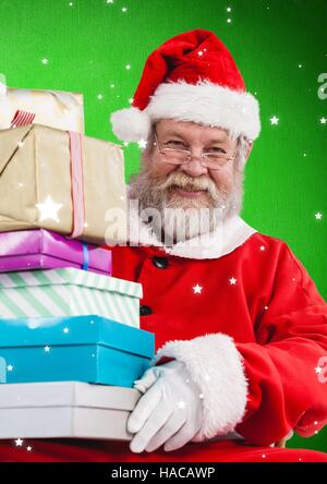 Stack of Christmas gifts in snow Stock Photo - Alamy