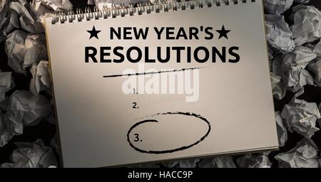 New year resolution goals against crumpled paper balls in background Stock Photo