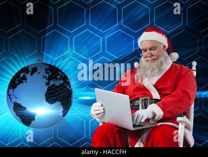Santa sitting on chair and using laptop 3D Stock Photo