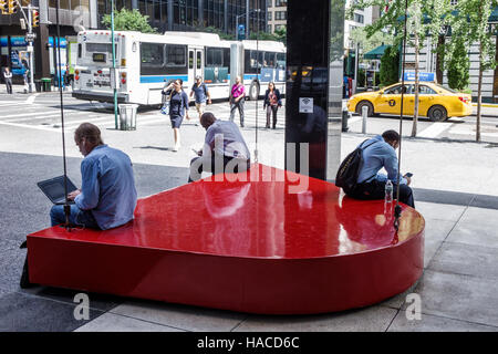 New York City,NY NYC Manhattan,Midtown,777 Third Avenue,office building,plaza,Big Red Swing,pop-art,sculpture,Theodore Cerali,businessman,laptop,sitti Stock Photo