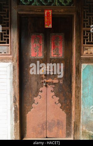 Old chinese wooden door in a home at Yongding town, Fujian china. Stock Photo