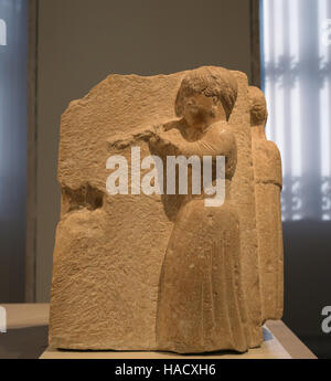 Auletris (aulos playing woman). Iberian relief of Osuna, Seville province, Spain. 3rd-2nd BCE. National Archaeological Museum, Madrid. Spain. Stock Photo