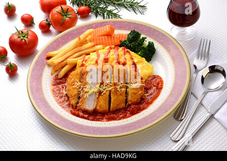 Japanese Pork Chop with rice omelet and tomato sauce Stock Photo