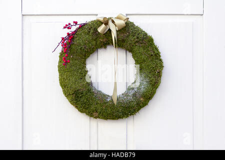 Advent Christmas wreath on white door decoration Stock Photo