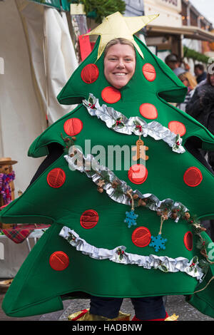 Woman dressed up as Christmas Tree at Victorian Festival of Christmas at Portsmouth, Hampshire, England UK in November Stock Photo