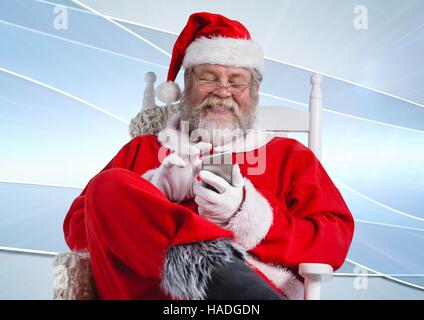 Santa claus using mobile phone Stock Photo