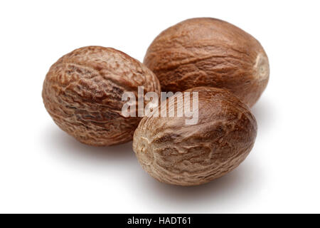 Three Nutmeg on white background. Stock Photo