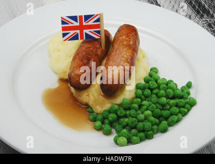 British sausage and mash with peas and gravy showing the union flag Stock Photo