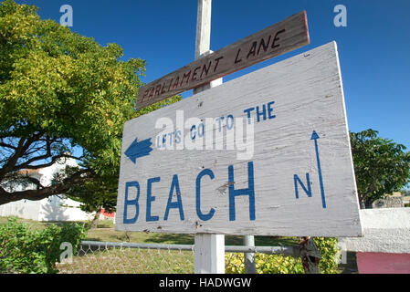 Sign to the beach along the King's Highway in Alice Town on the tiny Caribbean island of Bimini, Bahamas Stock Photo