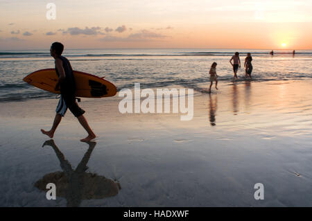 Surfers on the beach of Kuta. Surfing lessons. Bali. Kuta is a coastal town in the south of the island of Lombok in Indonesia. The scenery is spectacu Stock Photo