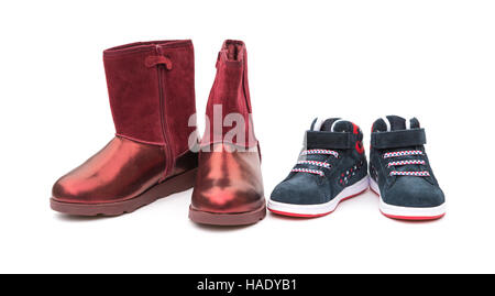 black shoes for son and red ones for mom on white as filiation concept Stock Photo