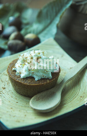 Mi-Cuit Châtaigne, french chestnuts dessert with whipped cream and star anise powder Stock Photo