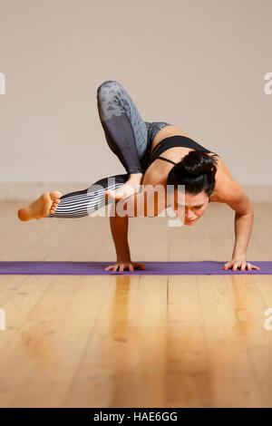 Woman doing exercise on balance Stock Photo