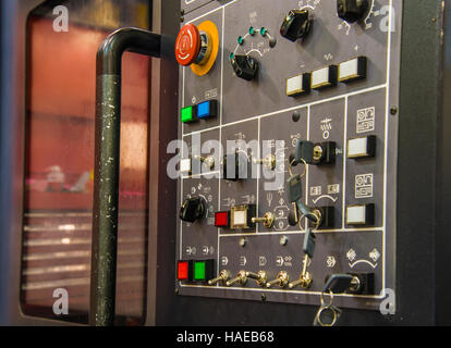 Modern CNC machining center with control panel on foreground. Close up view. Selective focus. Control panel of CNC machining center Stock Photo
