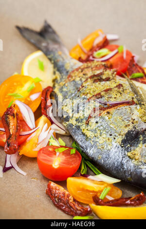 Raw whole sea bream fish and vegetables ingredients, ready to cook Stock Photo