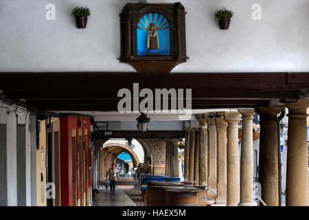 Arcades and columns in Galiana street in the famous ancient city of Aviles, Asturias, Spain. One of the stops of the Transcantabrico Gran Lujo luxury Stock Photo