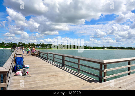 Looking back along Naples free public pier toward sandy beach, Golf of Mexico, Florida, USA Stock Photo