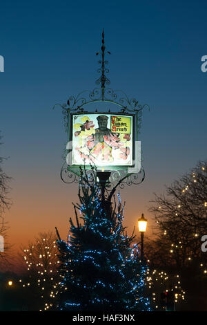 The Lygon Arms sign and Christmas tree decorations. Broadway, Cotswolds, Worcestershire, England Stock Photo