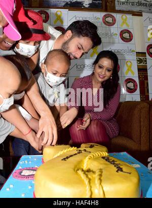 Varun Dhawan Amruta Fadnavis wife Devendra Fadnavis with cancer affected children visits CST Mumbai Stock Photo