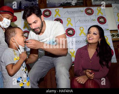 Varun Dhawan Amruta Fadnavis Devendra Fadnavis with cancer affected children visits CST Mumbai Stock Photo