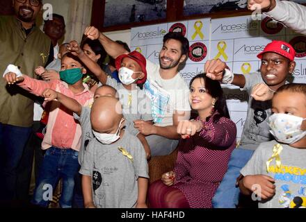 Varun Dhawan Amruta Fadnavis Devendra Fadnavis cancer affected children visits CST Mumbai Stock Photo