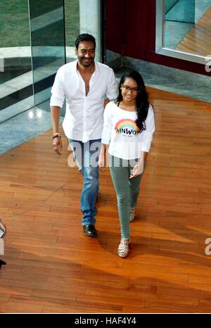 Bollywood actor Ajay Devgn with his daughter press conference of Smile Foundation announce new campaign She Can Fly Mumbai Stock Photo