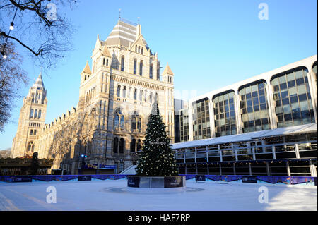 An actor plays The Snowman during a photo call at the Natural History Museum Ice Rink for the theatre production of The Snowman, running at the Peacock Theatre in London. Stock Photo