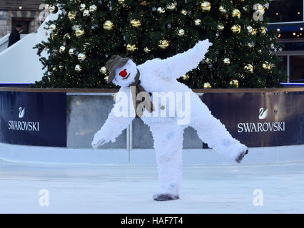 An actor plays The Snowman during a photo call at the Natural History Museum Ice Rink for the theatre production of The Snowman, running at the Peacock Theatre in London. Stock Photo