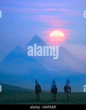 Full moon rising behind the Pyramids, Giza, Cairo, Egypt Stock Photo