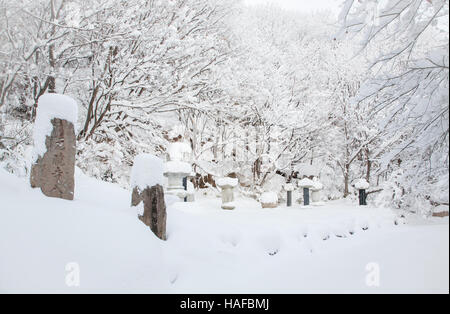 Buddhist stupas(towers) covered with snow temple in South Korea Stock Photo