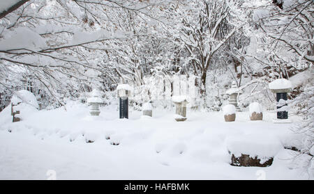 stupas covered with snow in Buddhist temple in South Korea Stock Photo