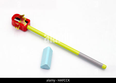 View of a pencil sharpener, an eraser and a pencil isolated on a white background. Stock Photo