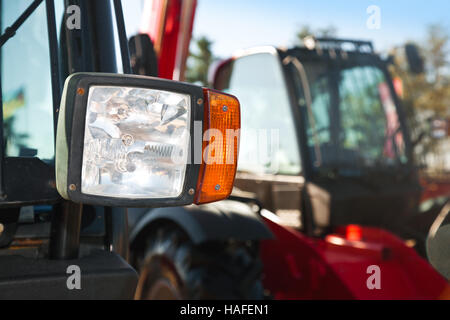 Tractor headlight, huge machine with light equipment also used for tractors, excavators, loaders and other machines, focused on spotlight, selective f Stock Photo