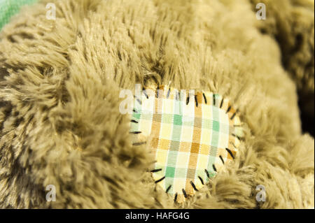 Heart on a teddy bear toy closeup shot Stock Photo